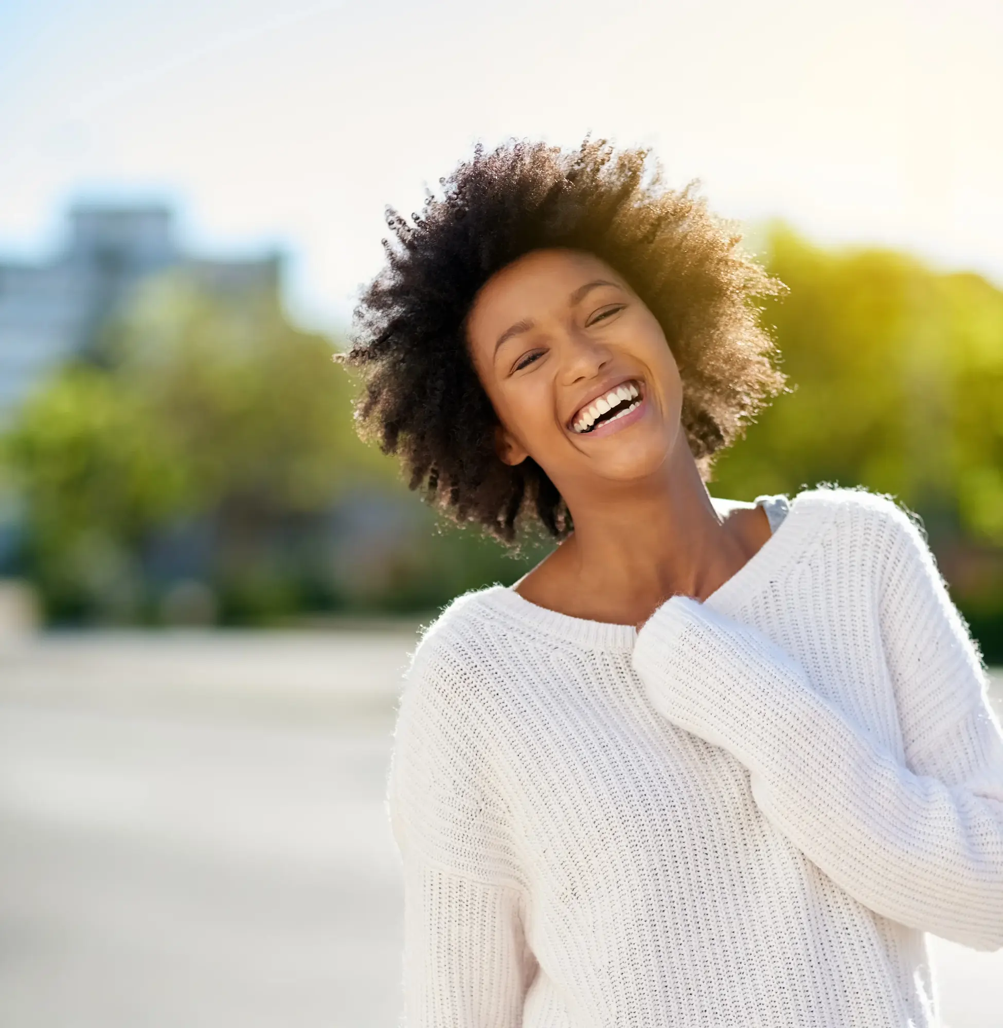 Patient smiling confidently outdoors